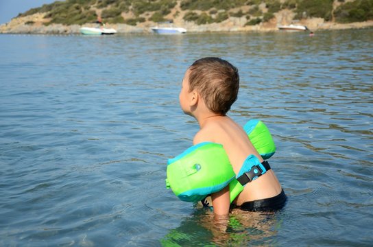 Boy playing in Aegean Sea