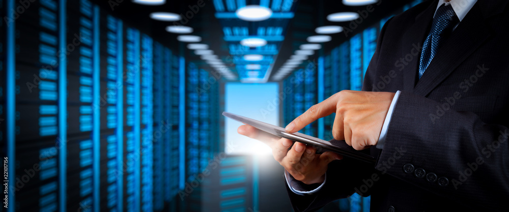 Poster Businessman working with VR wide blank screen computer on server room in background.