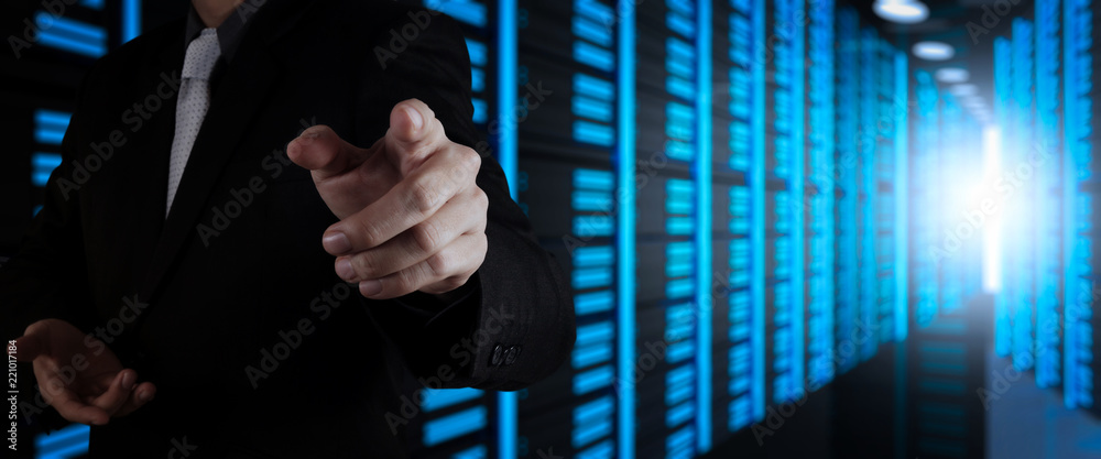 Poster Businessman working with VR wide blank screen computer on server room in background.