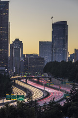Fototapeta na wymiar A long exposure of the Seattle skyline with car light trails