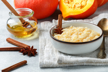 Delicious rice porridge with pumpkin, honey, cinnamon and star anise. Diet healthy Breakfast