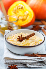 Delicious rice porridge with pumpkin, honey, cinnamon and star anise. Diet healthy Breakfast