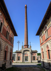 Fototapeta na wymiar the chimney of worker village, World Heritage Site.Crespi d'Adda Italy