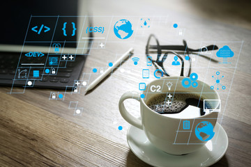 Coffee cup and Digital table dock smart keyboard,eyeglasses,stylus pen on wooden table,filter effect