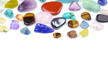 Natural colorful gem stones on white background.