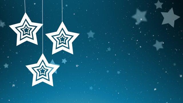 Snowfall and hanging Christmas stars on blue copy space background. Greeting card.