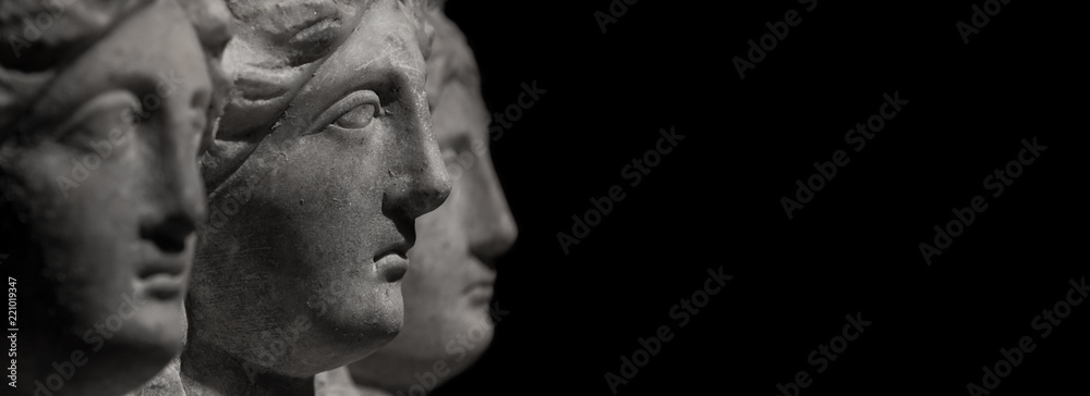 Wall mural Marble ancient heads of women watching each other