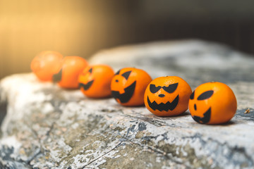 Group of oranges face painting with scary on halloween party day at the garden place.