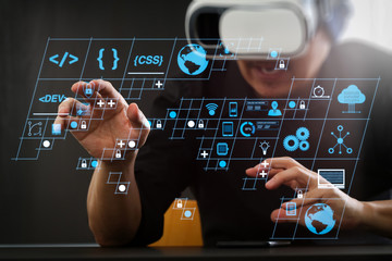 businessman wearing virtual reality goggles in modern office with Smartphone using with VR headset