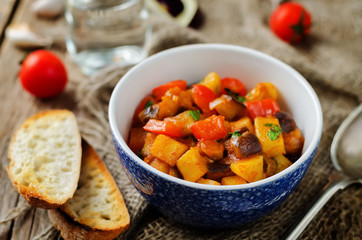 Eggplant potato Bell pepper goulash with bread slices