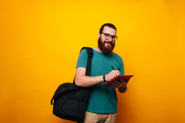 Happy young man working on tablet