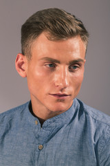 Obraz premium Handsome man posing in the studio for clothes shooting