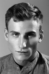 Handsome man posing in the studio for clothes shooting