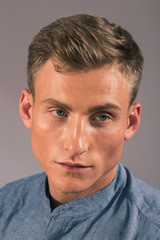 Fototapeta premium Handsome man posing in the studio for clothes shooting