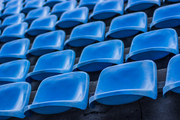 Naklejka premium sport football stadium empty blue dirty plastic seats 