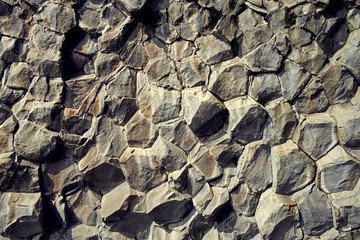 Basalt stone columns close-up on Reynisfjara black beach