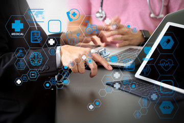 Medical co working concept,Doctor working with smart phone and digital tablet and laptop computer to meeting his team in modern office at hospital