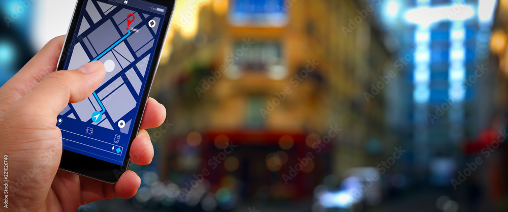 Poster Close up of Tourist using GPS map navigation on smartphone application screen for direction to destination address in the city with travel and technology concept.