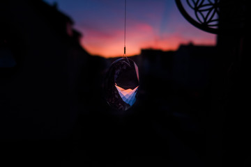 Glas Prisma hanging at window on sunset