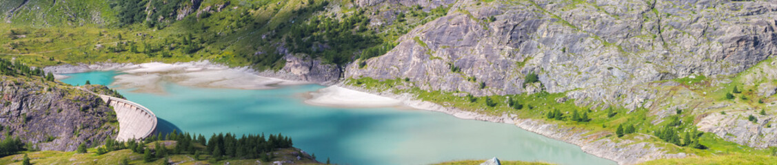 Panoramic Dam of the Margaritze Reservoir underneath the Grossglockner Mountain glacier