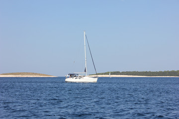 Sail boat on blue water