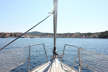 Sail boat on blue water