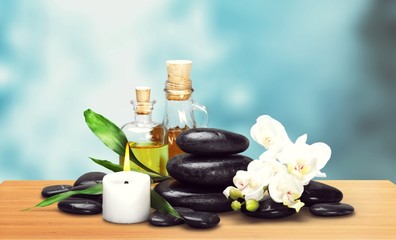 Zen basalt stones and aroma oil on the white