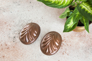 Vintage copper molds on a concrete background.