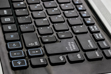 computer keyboard with word fake news