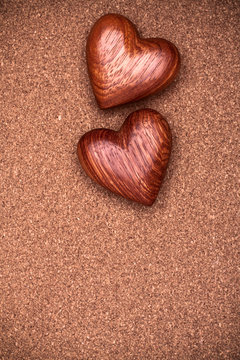 Two wooden hearts on rustic wood background. Valentines days concept.  Love symbol. Greeting card with copy space.