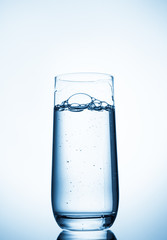 water glass on blue background