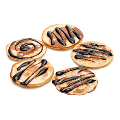 pancakes with chocolate syrup isolated on white background cutout.