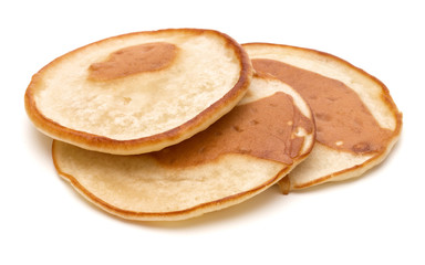 Three pancakes isolated on white background cutout.