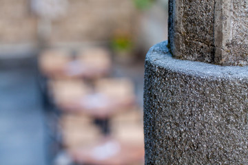 A stone pillar on an abstract background.