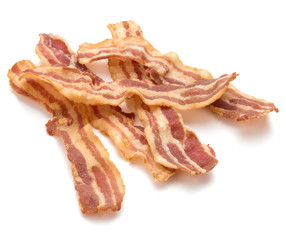 cooked crispy slices of bacon isolated on white background