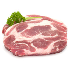 Raw pork neck chop meat with parsley herb leaves garnish isolated on white background cutout