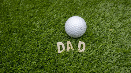 Golf with Dad word on green grass for golfer's father day