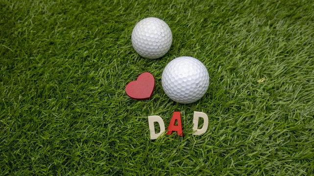 Golf with Dad word on green grass for golfer's father day