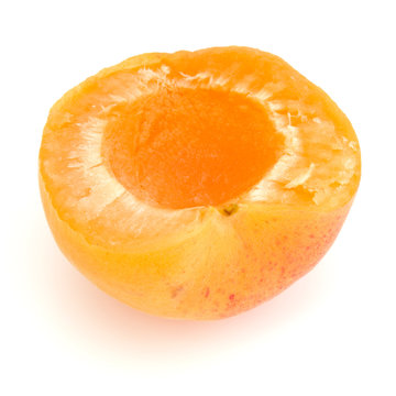 One apricot half isolated on white background cutout