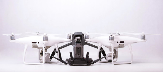 three drones on a white background
