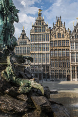 Fototapeta na wymiar Fountain and guildhalls in the city center of Antwerp, Belgium