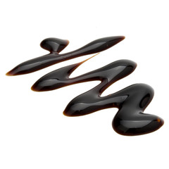 Balsamic vinegar cream isolated on white background. Italian salad dressing, sauce.