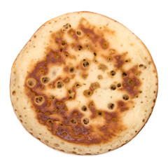 One pancake isolated on white background cutout. Top view.