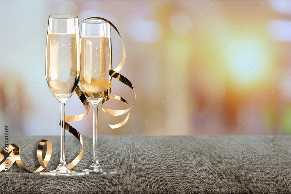 Sticker Two glasses of champagne isolated on white background