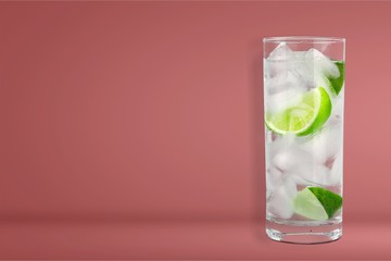 Glasses with fresh organic cucumber water on wooden table, on