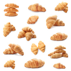 Set with fresh tasty croissants on white background