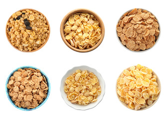 Set with bowls of breakfast cereals on white background, top view. Healthy whole grain recipe