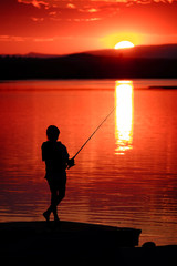 Young Child Kid Person Fishing in Lake or River Sunset