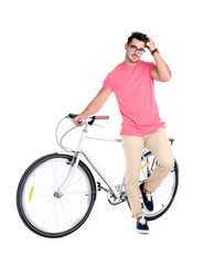 Fototapeta na wymiar Handsome young hipster man with bicycle on white background