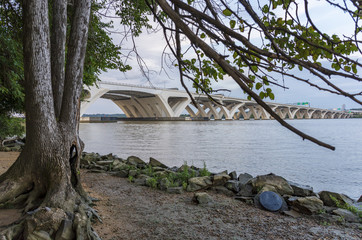 The Woodrow Wilson Memorial Bridge spans the Potomac River between Alexandria, Virginia, and the state of Maryland, as seen from Jones Point Park in Alexandria.